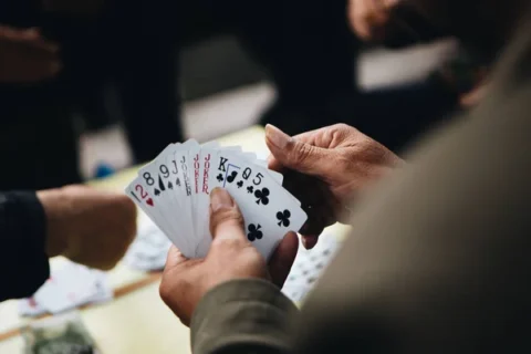 depositphotos 358081536 stock photo closeup people playing card game